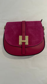 Runde Schultertasche aus Leder und Wildleder in Pink